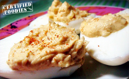First set of Deviled Eggs, topped with Paprika - Certified Foodies