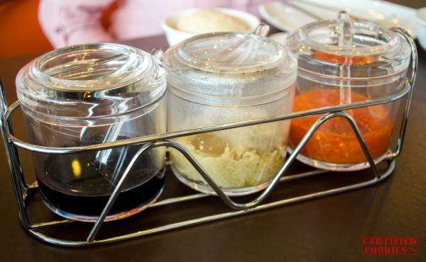 Wee Nam Kee condiments - dark soy sauce, ginger, chili sauce Wee Nam Kee condiments - dark soy sauce, ginger, chili sauce