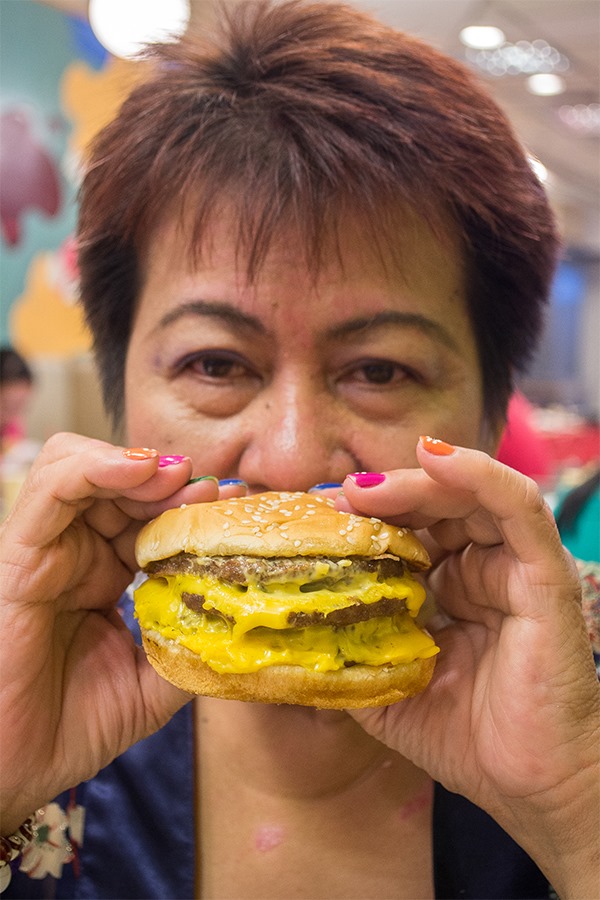 Our nanay taking on the Burger King BK Stack for the King