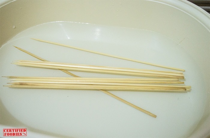 Soak the wooden skewers in water to prevent them from burning
