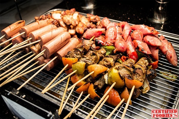 Kebabs, sausages and other meats ready for grilling