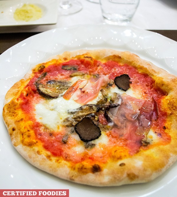 Truffle pizzetta with prosciutto, porcini mushrooms, and imported buffalo cheese